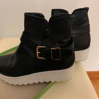 Scarpe con para alta