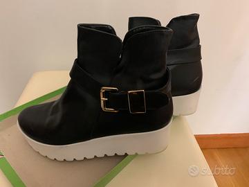 Scarpe con para alta