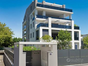 ESCLUSIVO appartamento con giardino e porticato