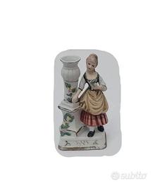 Statuina vintage in ceramica con portacandela.