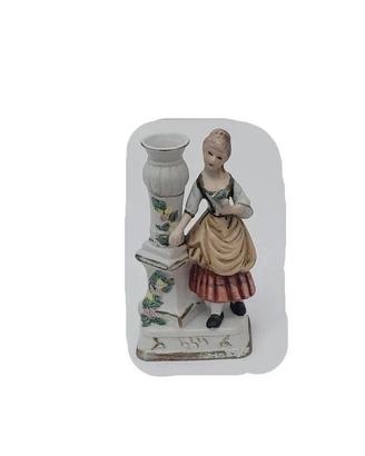 Statuina vintage in ceramica con portacandela.