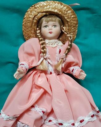 Bambola in porcellana da collezione