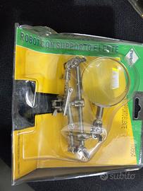 2 blister con supporto e pinze + lente di ingrandi