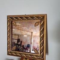 specchio con cornice dorata