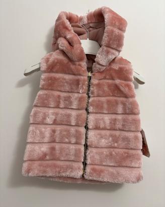 Gilet di pelliccia da bambina  stock