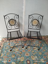 due sedie in ferro da giardino pieghevoli