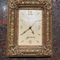 Cornice oro con orologio funzionante