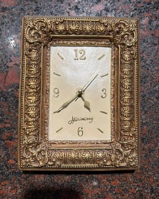 Cornice oro con orologio funzionante