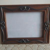 Cornice in legno e ferro battuto 