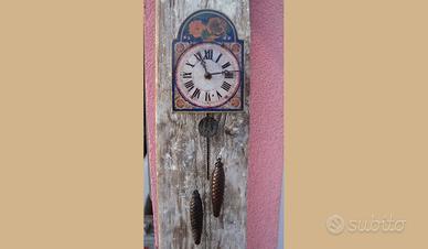 Orologio pitturato con pesi