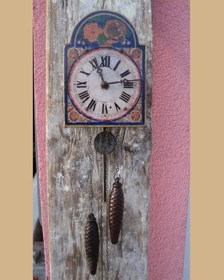 Orologio pitturato con pesi