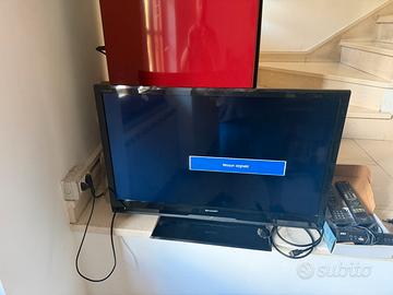 Tv sharp con decoder e telecomandi inclusi
