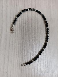 bracciale artigianale con pietre nere e oro bianco