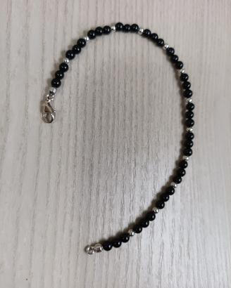 bracciale artigianale con pietre nere e oro bianco