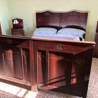 Letto matrimoniale testiera e pediera intagliate