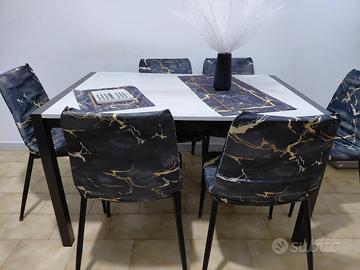 cucina completa con tavole e sedie