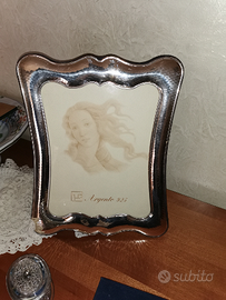 Cornice e quadri in argento