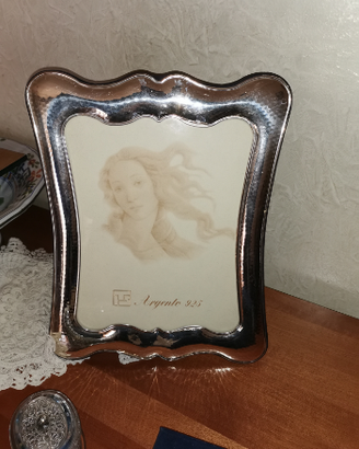 Cornice e quadri in argento