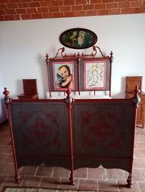 Antico letto in ferro battuto