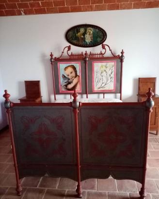 Antico letto in ferro battuto