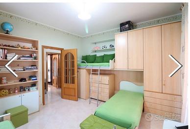 cameretta con tre lettini