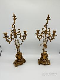 Coppia di candelabri con angeli putti candelieri