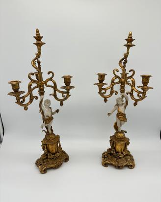 Coppia di candelabri con angeli putti candelieri