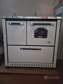 stufa cadel con forno e cestone porta legna.