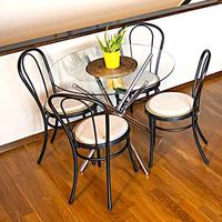 Tavolo rotondo in vetro con gambe in acciaio