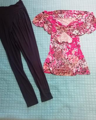 Blusa rosa elasticizzata e pantalone corsaro.