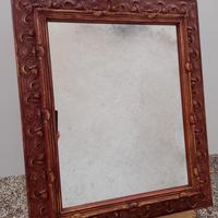 Specchiera con cornice dorata