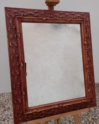 Specchiera con cornice dorata