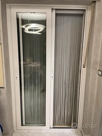 Porta a due ante scorrevole con doppio vetro