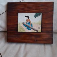 ceramica in cornice di legno