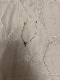 Bracialetto oro con ciondolo rosso e stella