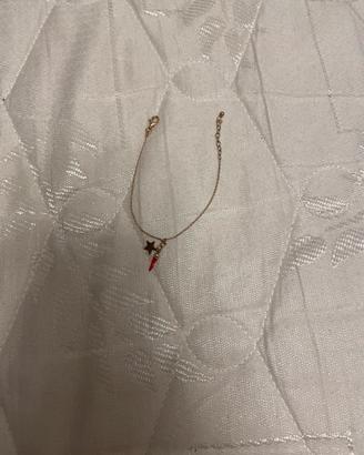 Bracialetto oro con ciondolo rosso e stella