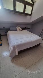 Letto matrimoniale contenitore con testiera