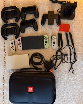 nintendo switch oled + giochi + accessori
