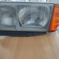Faro sinistro Mercedes 190E (lato guida)