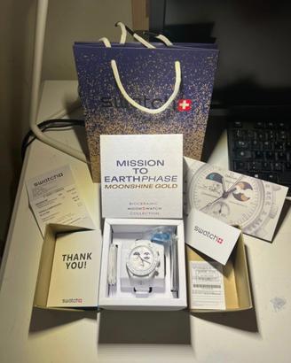 omega swatch mission to earthphase mooshine gold