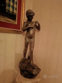 statua 