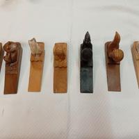 7 FERMAPORTE IN LEGNO SCOLPITO PERIODO DECO' 1920