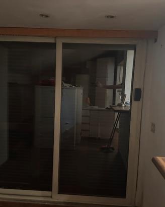 Porta finestra scorrevole due ante e porta esterna