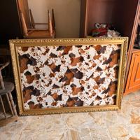 Cornice dorata con intagli