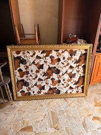 Cornice dorata con intagli