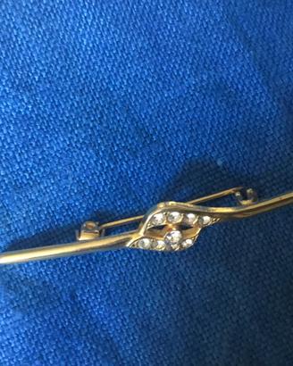 Spilla dorata argento 925 con zaffiri bianchi