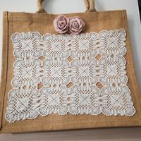 Borsa artigianale ricamata a mano in iuta e cotone