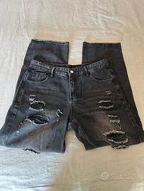 Jeans neri strappati uomo
