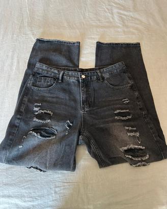 Jeans neri strappati uomo