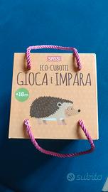 Torre di cubi e libro illustrato educativo 